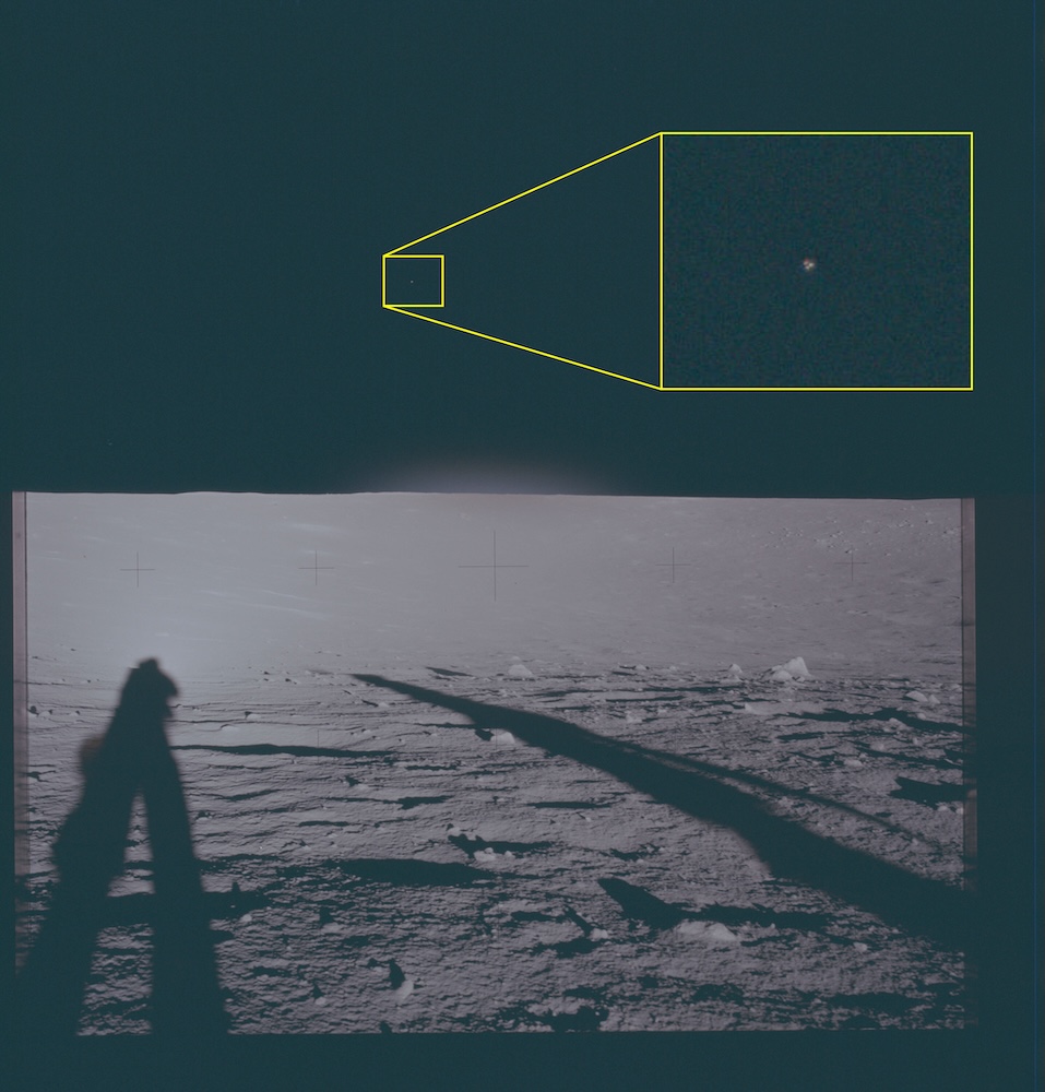 Photograph of the lunar surface showing astronaut shadows and a magnified callout of an object in the sky.